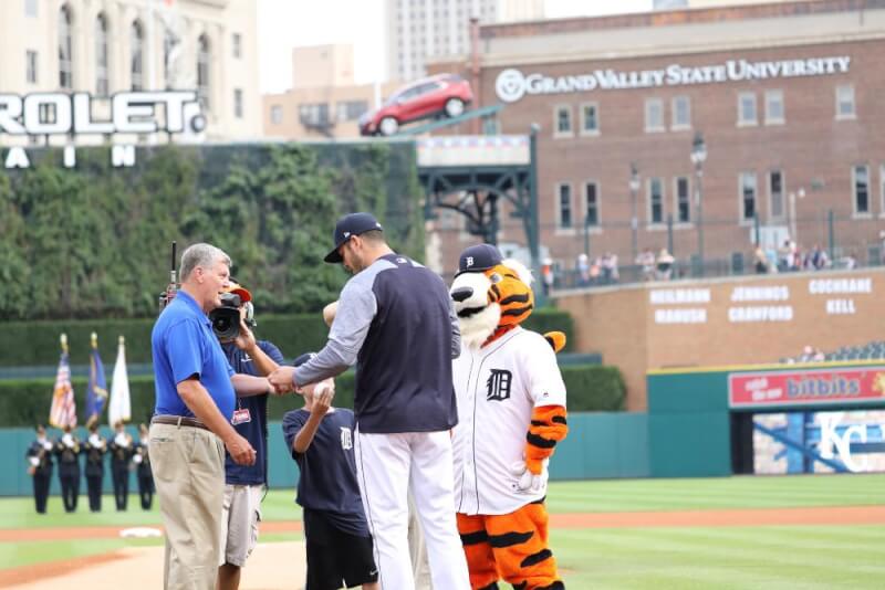 group of people on baseball mound
