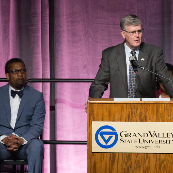 man at podium on stage
