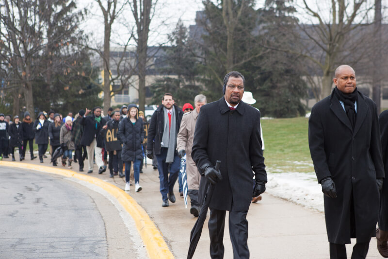People walking across campus