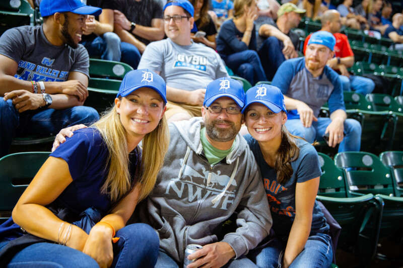 Lakers smiling in the stands.