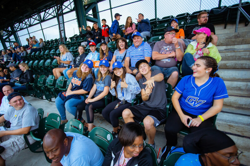 Lakers smiling in the stands.