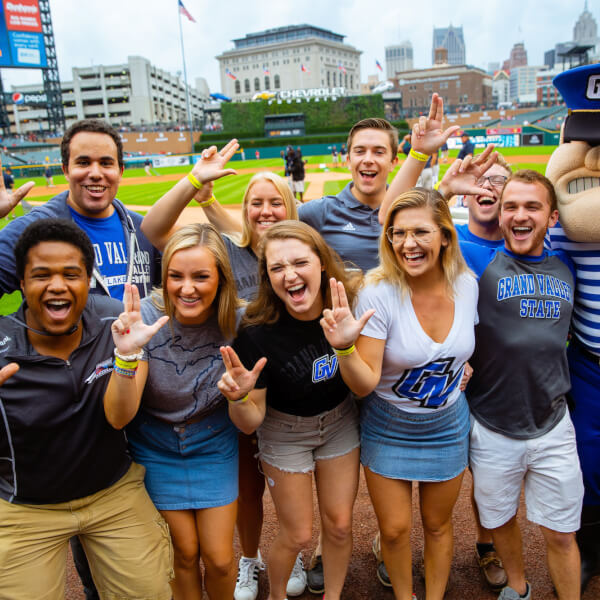 A group photo of students at the game.