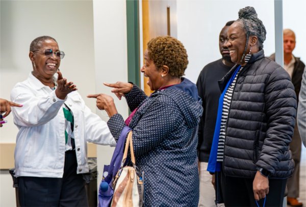 Executive assistant Marilyn Gilbreath, University Libraries operations coordinator Leah Thomas, and Nicole Payne, of Admissions and Recruitment, share a moment during the Juneteenth Celebration at the Kirkhof Center on June 18.