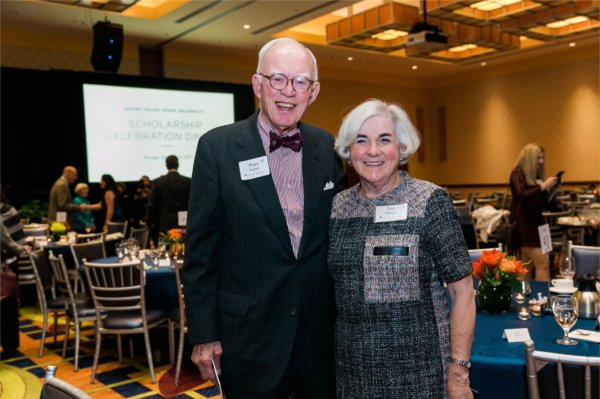 Peter Turner and Jean Enright with arms around each other at Scholarship Dinner