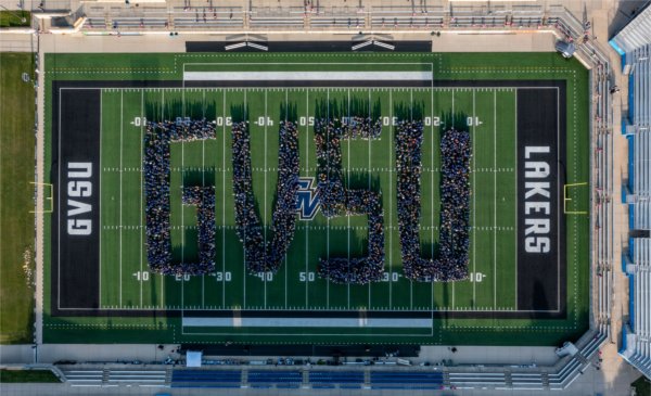  Aerial view of students on a football field spelling out &#8216;GVSU.&#8217;