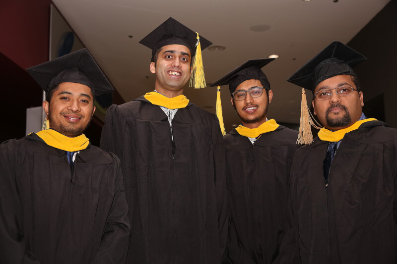 four men in academic robes