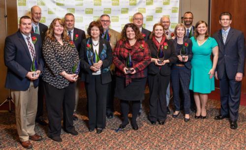 Provost Gayle Davis, front row and third from left, accepted the Beacon Award March 8 in Lansing.