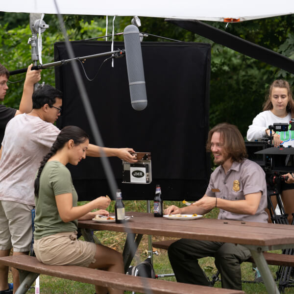 Members of the Summer Film Project crew work on a scene at Ottawa County's Hagar Park.