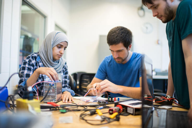Photo of engineering students working on a project