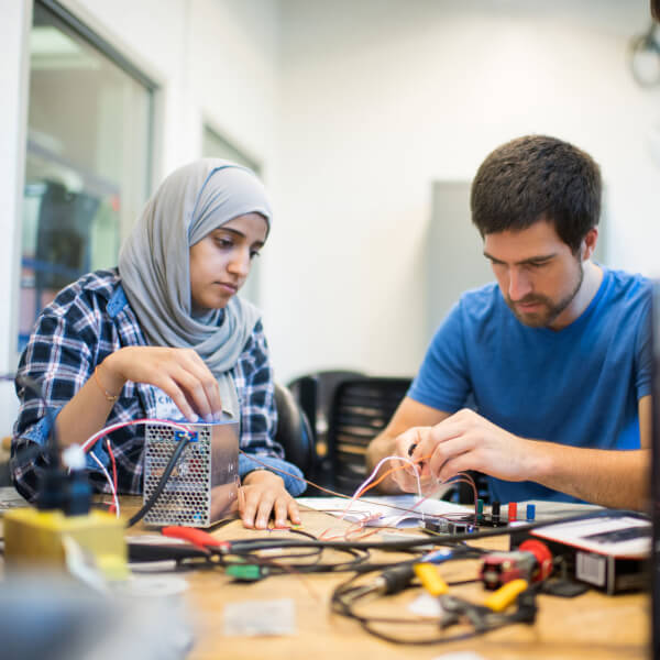 Photo of engineering students working on a project