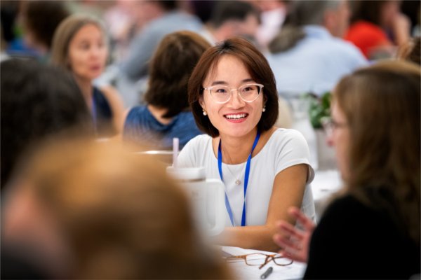Yu Rong, assistant professor of management, participates in a group discussion during Felten's presentation at the Eberhard Center.