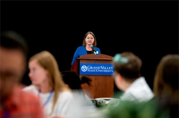 Christine Rener behind a podium
