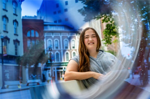 GVSU student Ava Politi poses for a photo in downtown Grand Rapids. 