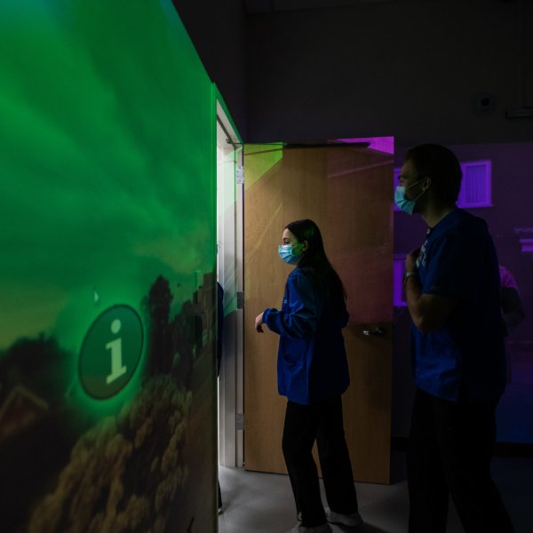 A student stands in the virtual reality lab.