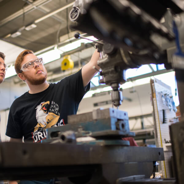A photo of two students working in a lab.