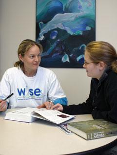 Laurie Witucki, associate professor of chemistry, meets with a student in WISE housing. The Women In Science and Engineering program supports students enrolled in mathematics, sciences or engineering.