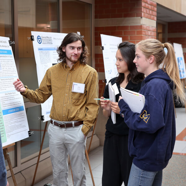 poster presentation, four people