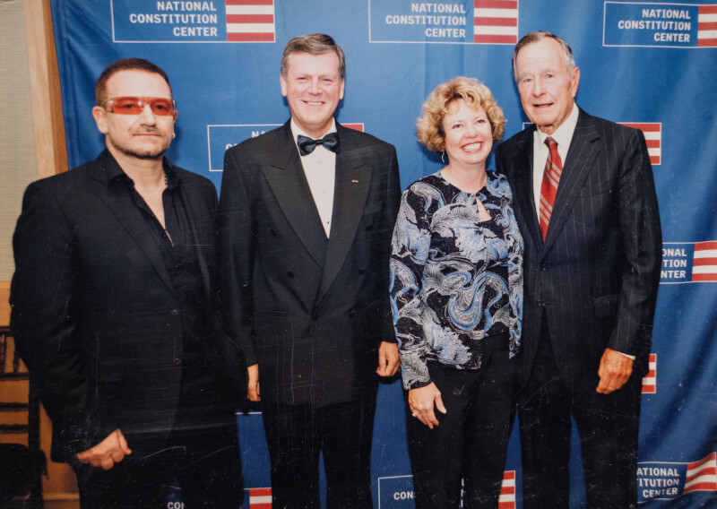 President Thomas J. Haas and Marcia Haas with President George H. W. Bush and Bono.