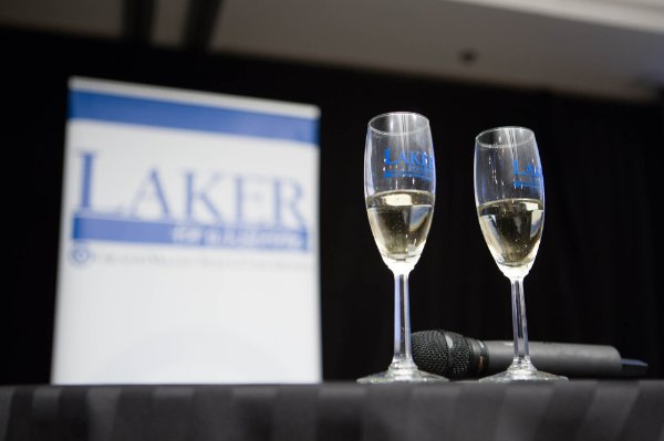 Two Champagne glasses that say "Laker for a Lifetime" sit on a table at a former toast to the graduating class. 