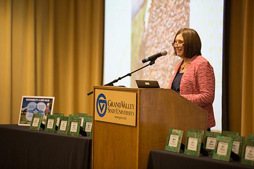 Anne Hiskes, dean of the Brooks College of Interdisciplinary Studies, presents an award at last year's ceremony.