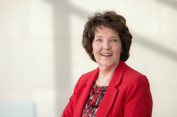 Tricia Thomas in red jacket