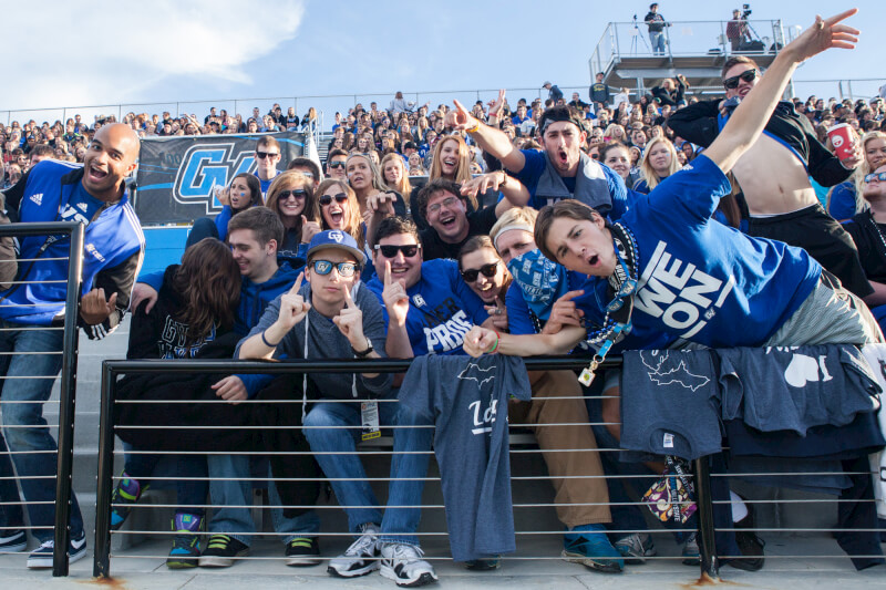 Students take in a football game at Lubbers Stadium.