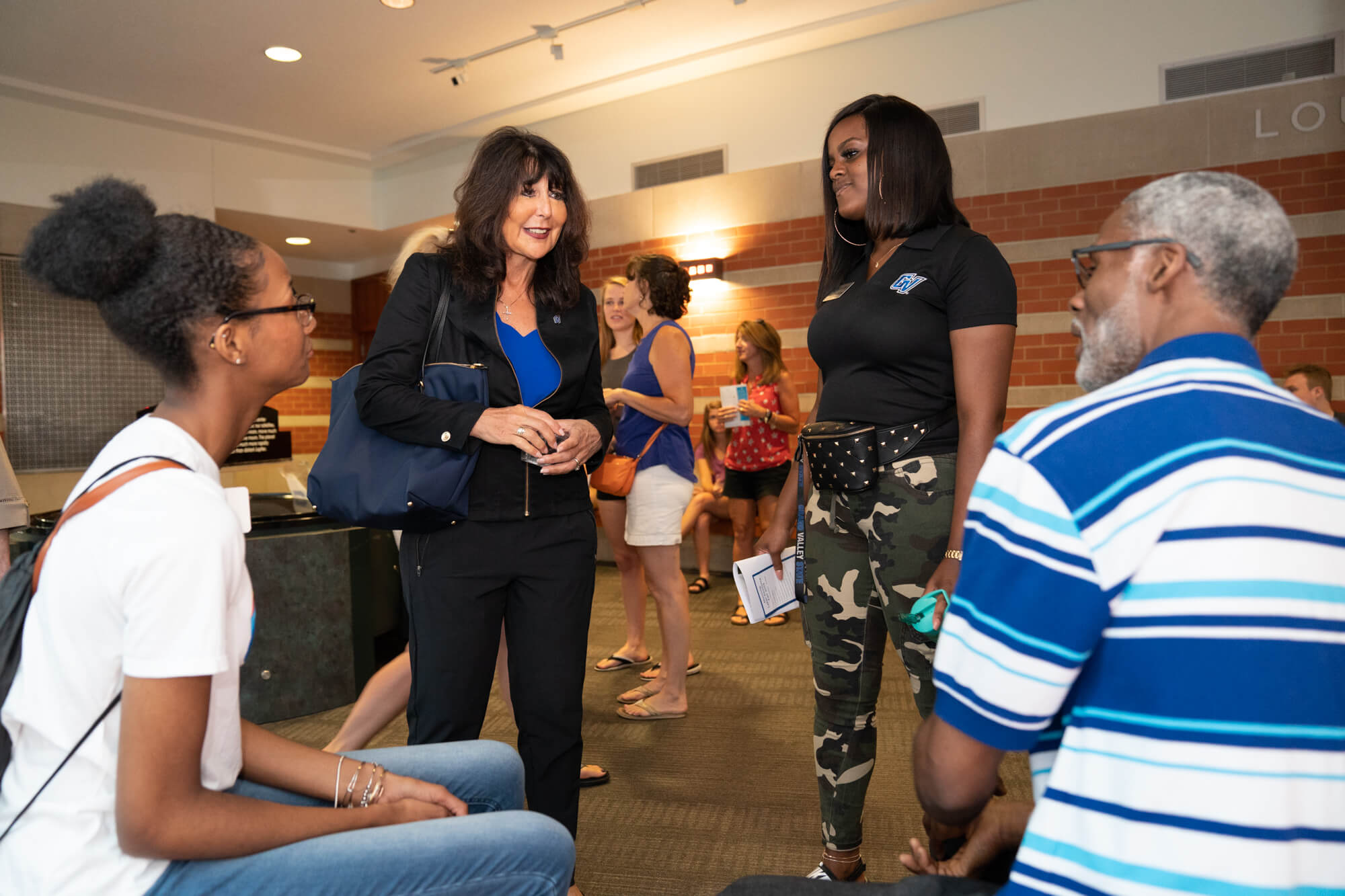 President Mantella greets students and parents at orientation on July 15.