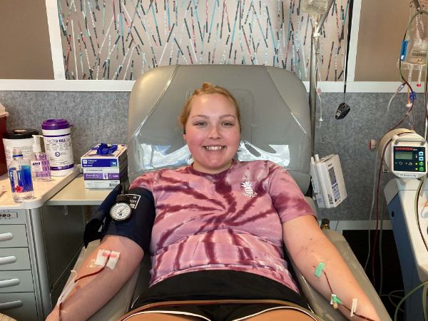 Annabelle Kopcan lies in a chair to donate stem cells.