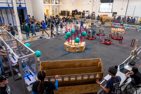 GVSU and high school students practice with their robots prior to a FIRST Robotics competition