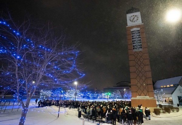 Students gather beneath the Cook Carillon Tower.