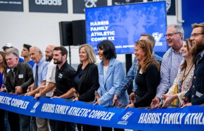 Grand Valley administrators, member of the Harris family and other guests cut the ceremonial ribbon to dedicate the new Harris Family Athletic Complex.