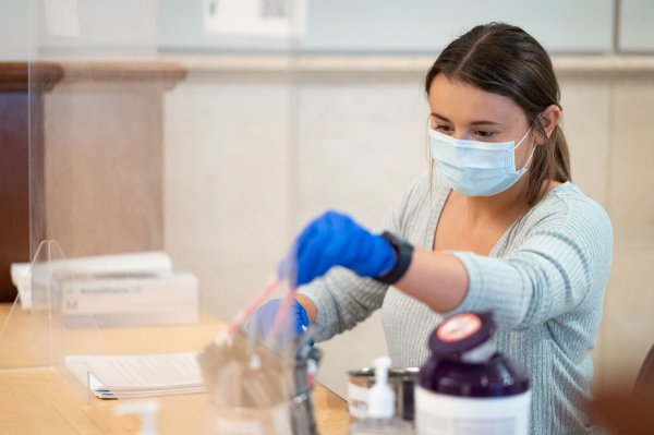 A student prepares a sample for the testing lab.