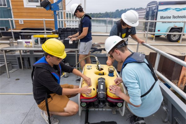Students in Northwestern Michigan College's marine technology program work on an underwater vehicle.
