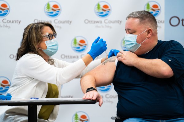 nurse giving man a shot