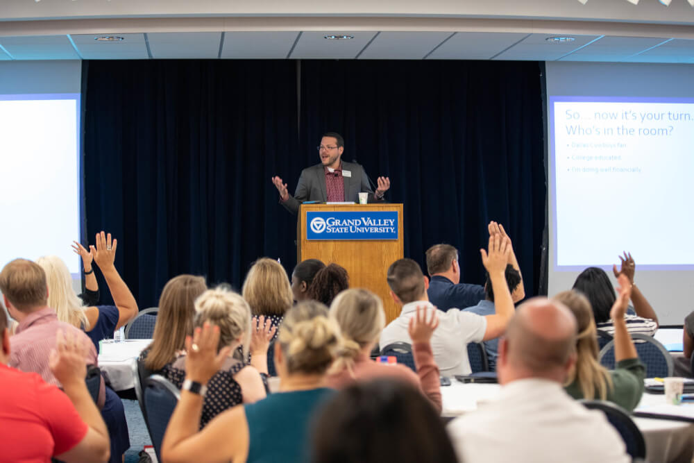 Dr. Jesse Bernal, vice president for Inclusion and Equity, speaks to a crowd.