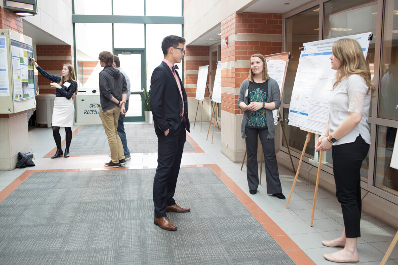 students at poster presentation