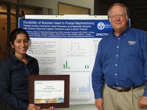 Nadia Sunny, left, with Robert Bossemeyer at the  2015 Research Symposium.