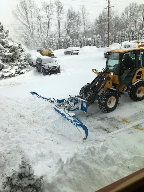 GVSU staff removing snow from the Allendale Campus.