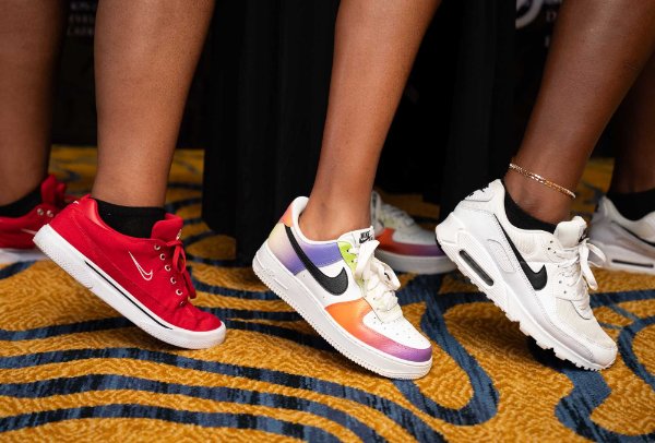 three sneakers are pictured at the Sneaker Ball, red, rainbow and white