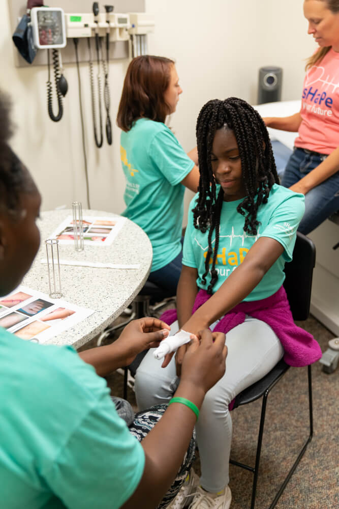 About 80 middle school students explored health careers during a summer camp at Grand Valley State University.