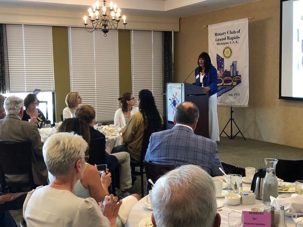 President Philomena V. Mantella addresses members of the Rotary Club of Grand Rapids.