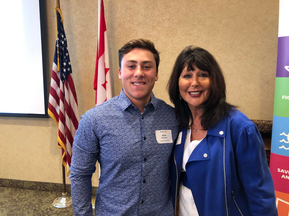 President Philomena V. Mantella with Alex Newman, who will be a freshman at Grand Valley in the fall.