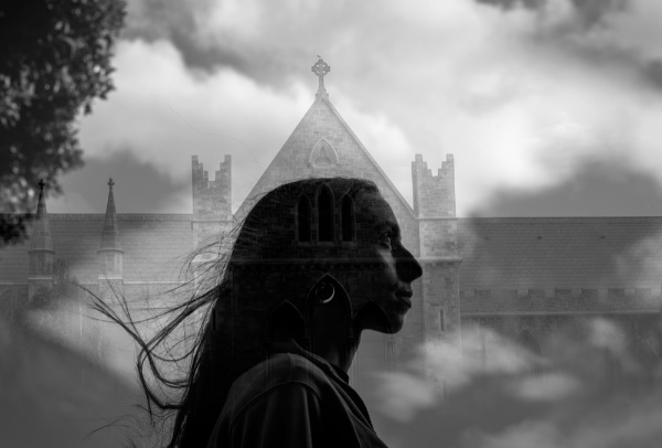 Double exposed, black-and-white photo showing GVSU Senior Isabel Wychuyse and St. Patrick's Cathedral in Dublin, Ireland.