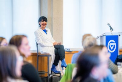 President Philomena V. Mantella answers questions after a HerStory presentation to a large crowd.