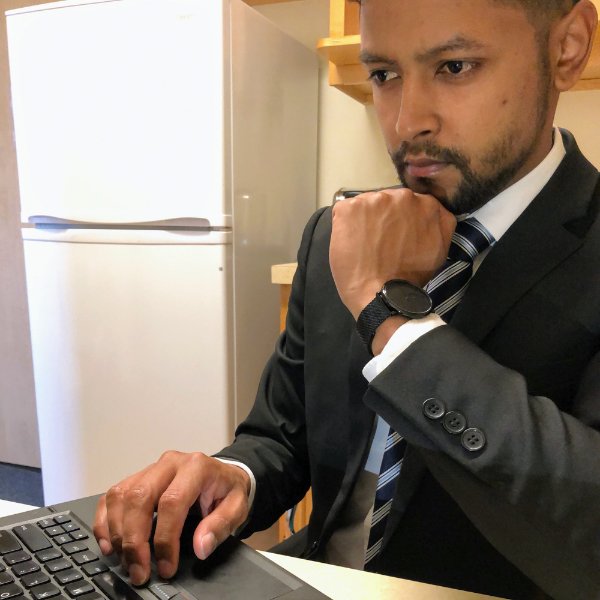 Photo of a GVSU graduate student at a computer.