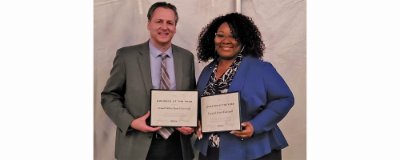 Chris Plouff and Crystal Scott-Tunstall hold their WMEAC awards