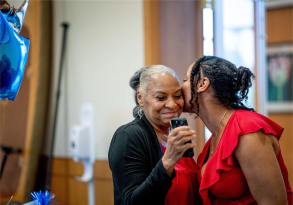 Love Jordan, right, kisses her mom, Emma Howard, left, after her pitch for her business Loving Embrace during the Michigan Veteran Entrepreneur-Lab final pitch event in Seidman Center May 13.