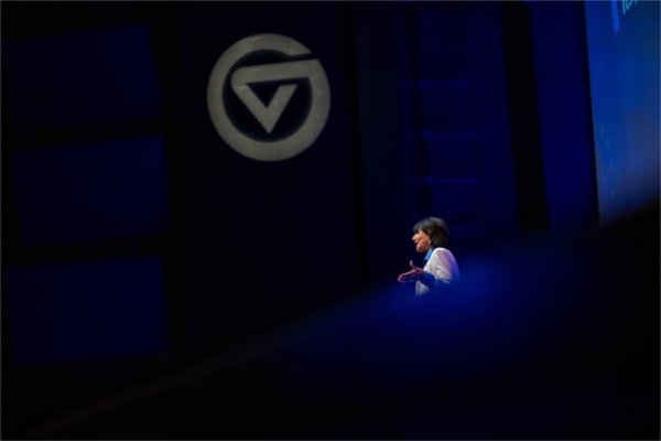  A college president speaks to a crowd during a university address. 