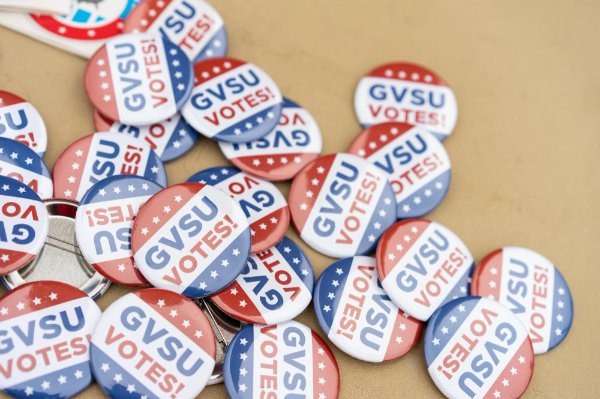 "GVSU Votes" buttons in a pile on a table