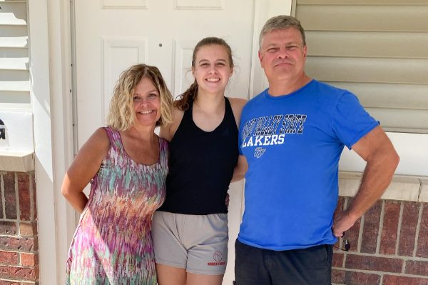 Linda, Paige and Chip Johnston are pictured in front of Paige's Laker Village apartment